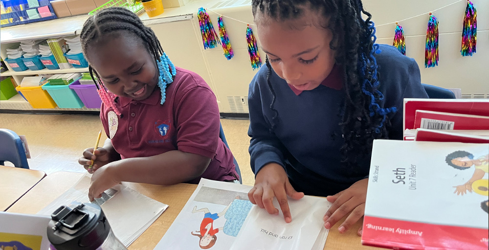 Citizenship & Science Academy of Syracuse Second Graders are Reading in Class